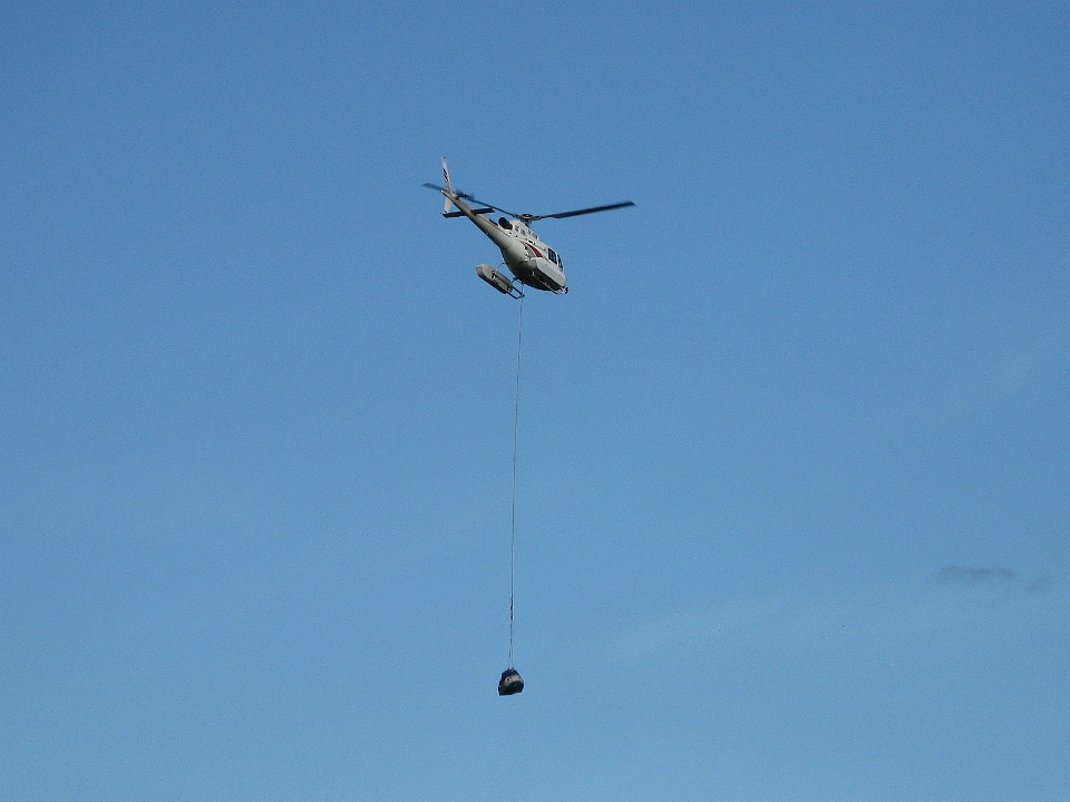 Helicopter Carrying out Hunters and Supplies